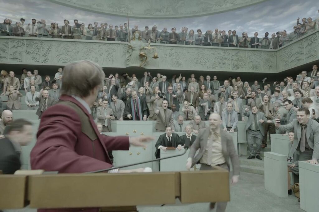 Een tumultueuze vergaderzaal in de trailer van Digger van Alejandro González Iñárritu