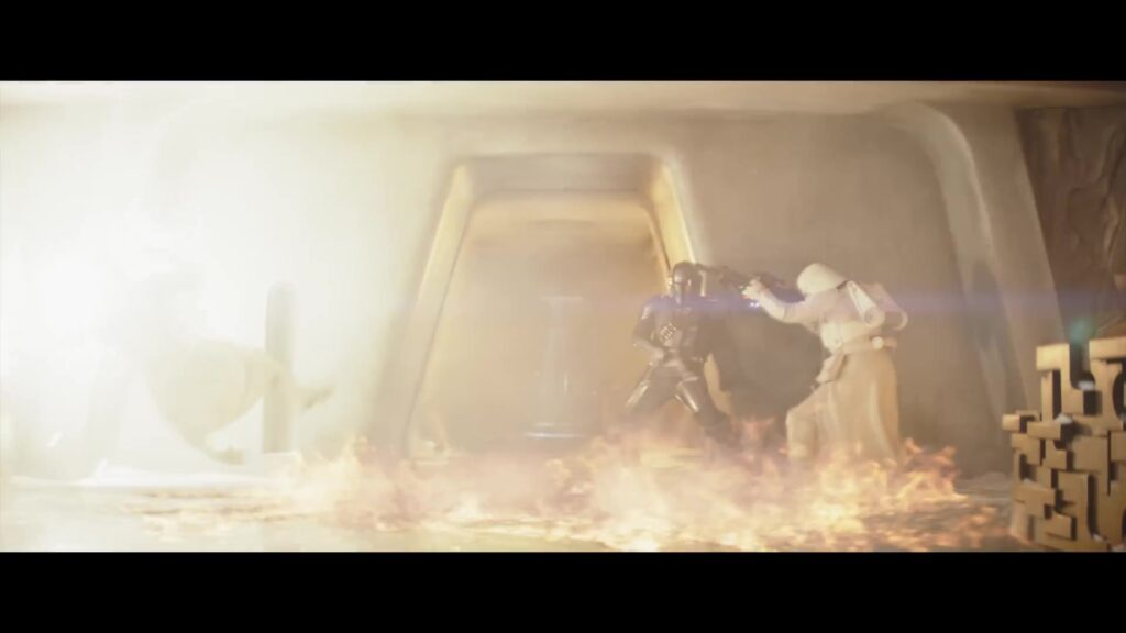 De Mandalorian vecht met een stormtrooper tussen de vlammen in de trailer van The Mandalorian and Grogu